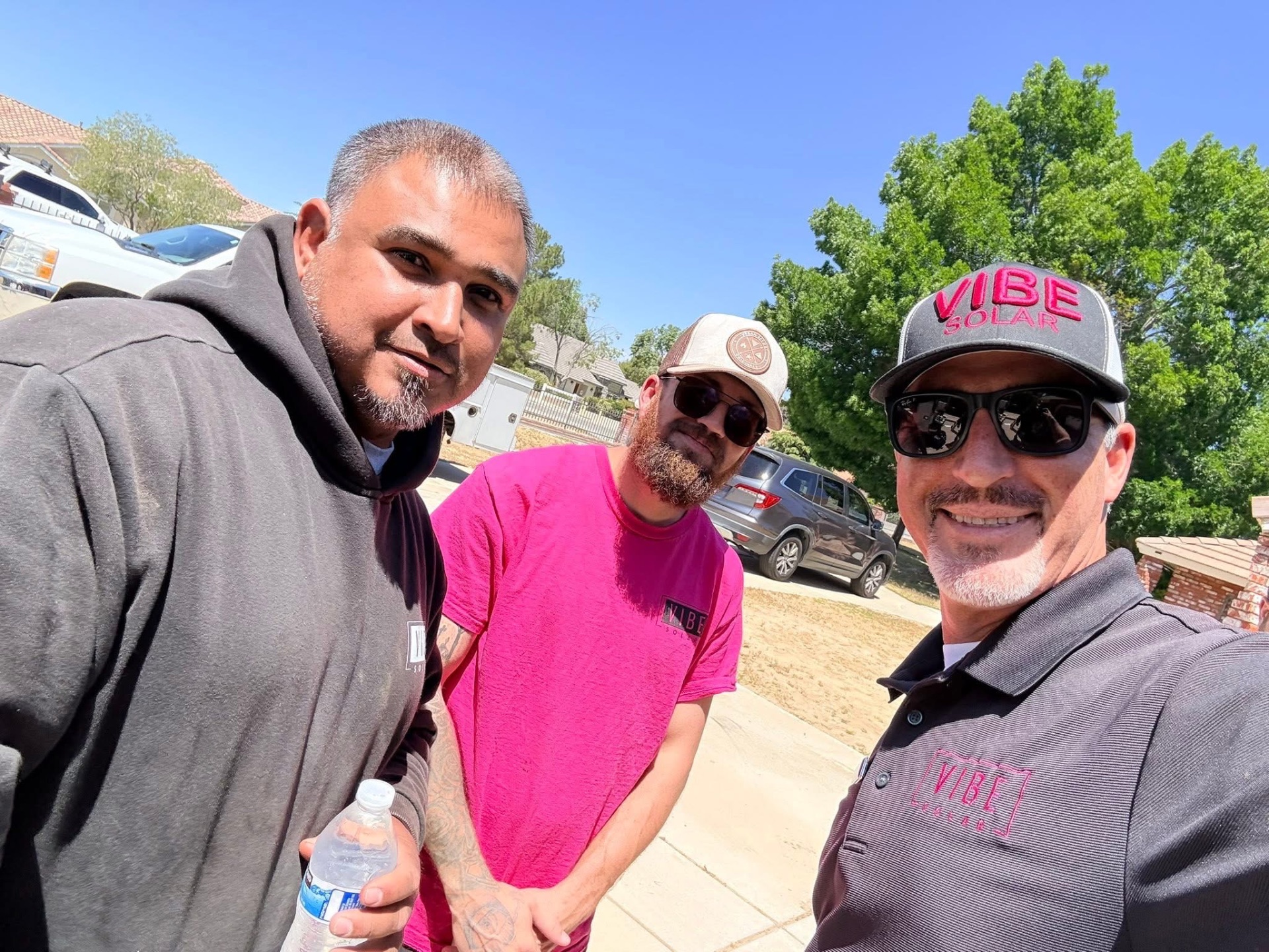 Three Vibe Solar team members on-site